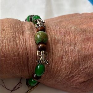 Hand Crafted Green and Brown Beaded Bracelet with Asian-Inspired Elegance